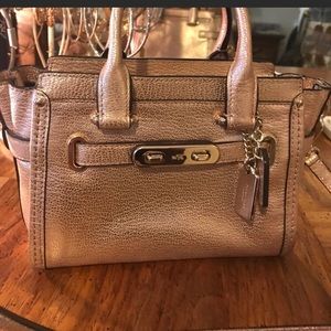 Beautiful rose gold coach mini swagger